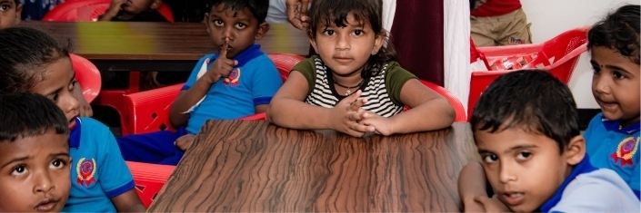 Sri Lankan children sitting at a classroom table