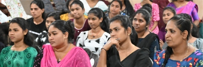 Group of Bangladeshi women sitting in a room attending a seminar