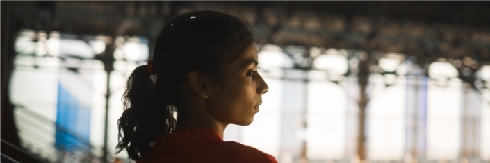 Head and shoulders picture of a woman looking to side of picture