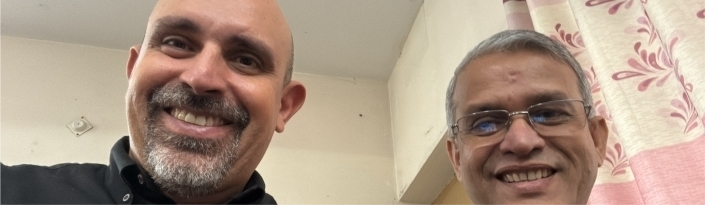 Two men smiling at camera