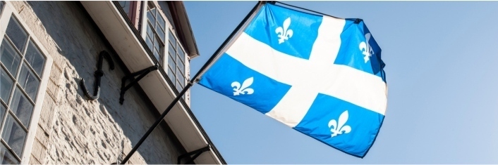 Quebec flag hanging outside a building