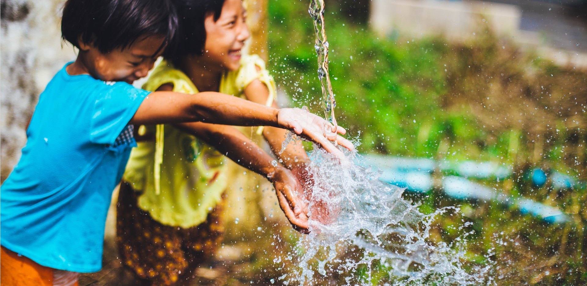 Two Girls Playing in Water