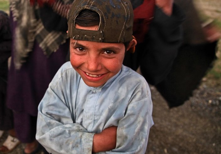 Smiling Boy with backwards hat